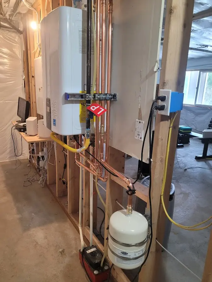 Licensed plumber repairing a kitchen sink in Eagle Lake